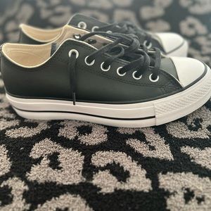 Converse chuck low top leather platform sneakers.